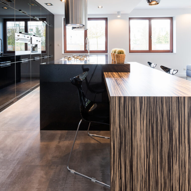 Cavernous interior of a elegant kitchen and dining room with large countertop