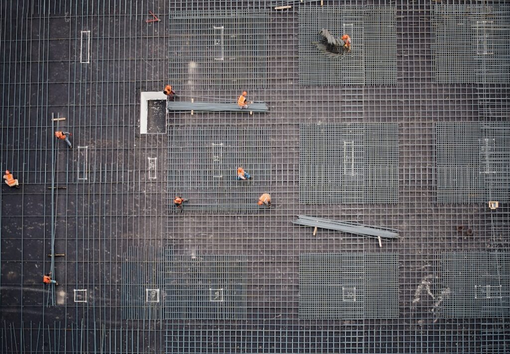 Photo Organized piles of construction materials at a busy job site