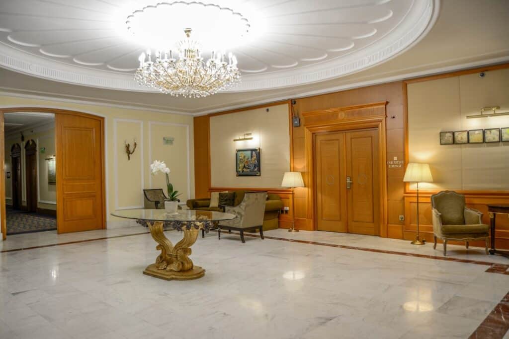 Photo A multifamily lobby with upscale flooring and elegant finishes